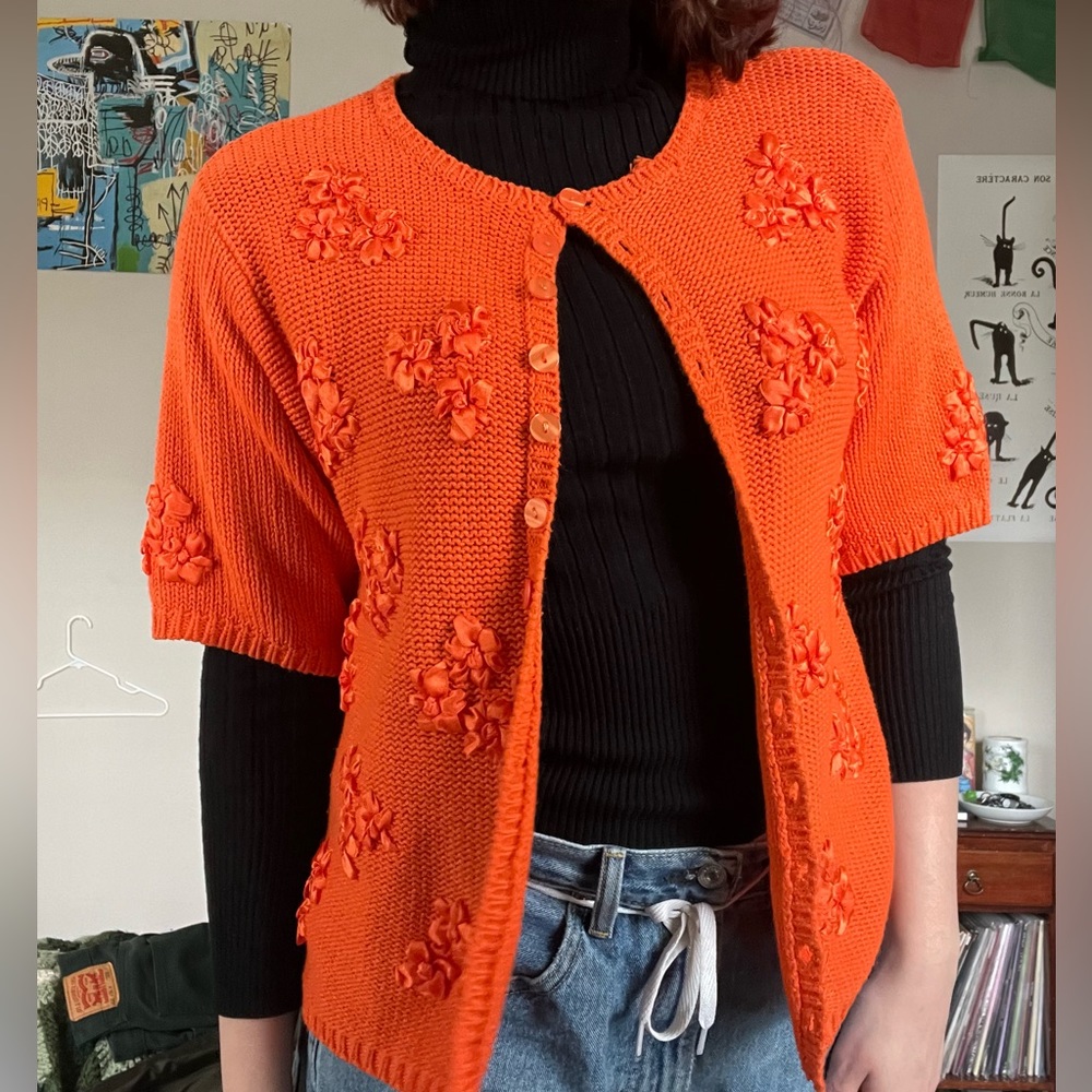 Orange cardigan with flowers. In great condition. Brand Victoria Sport.